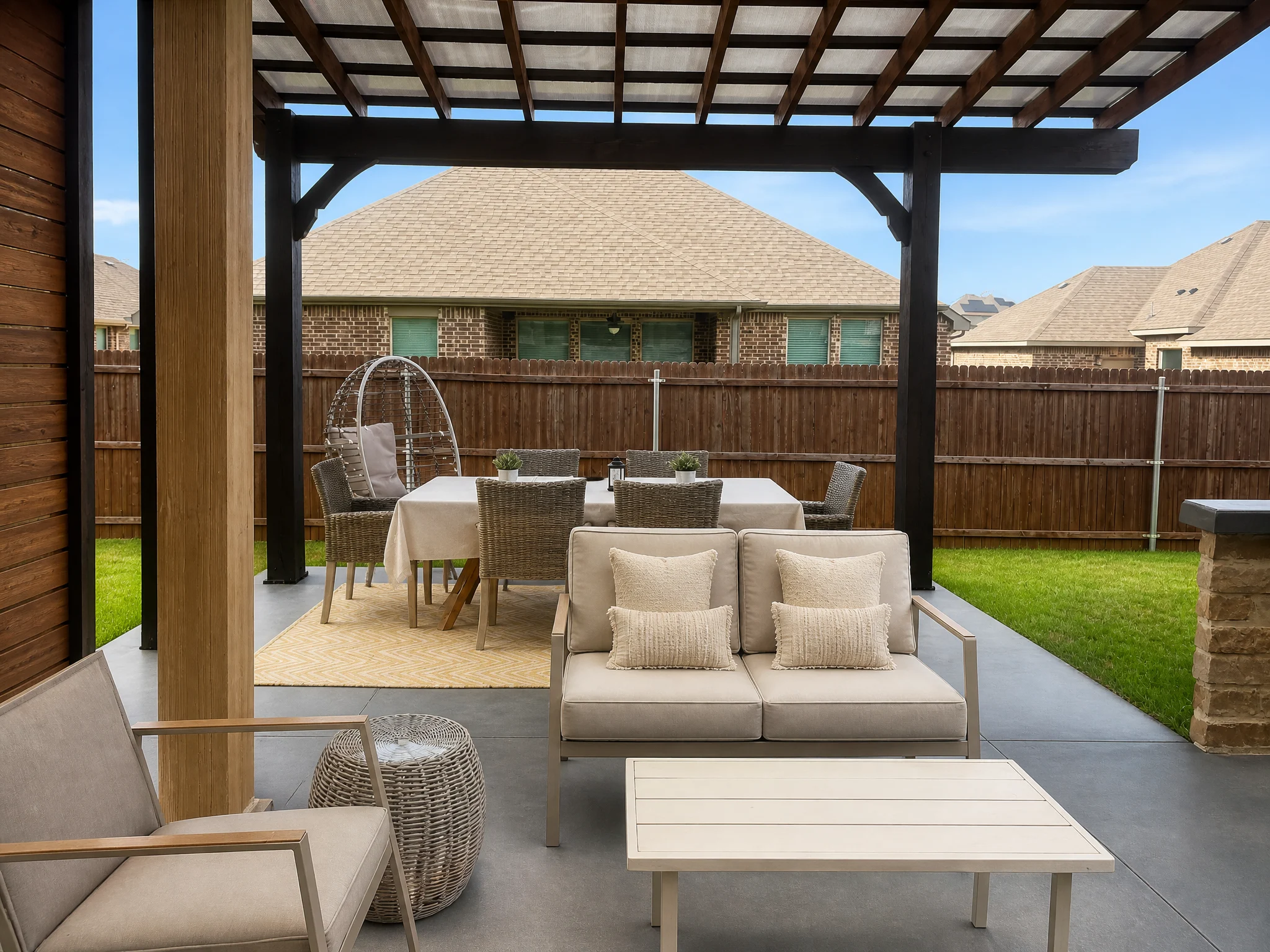 Backyard pergola with outdoor dining furniture