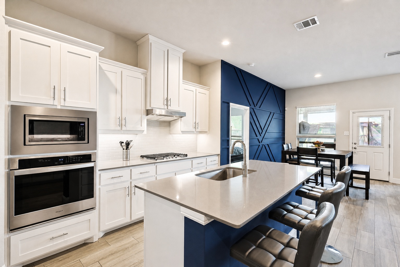 Kitchen and dining area with navy accent wall