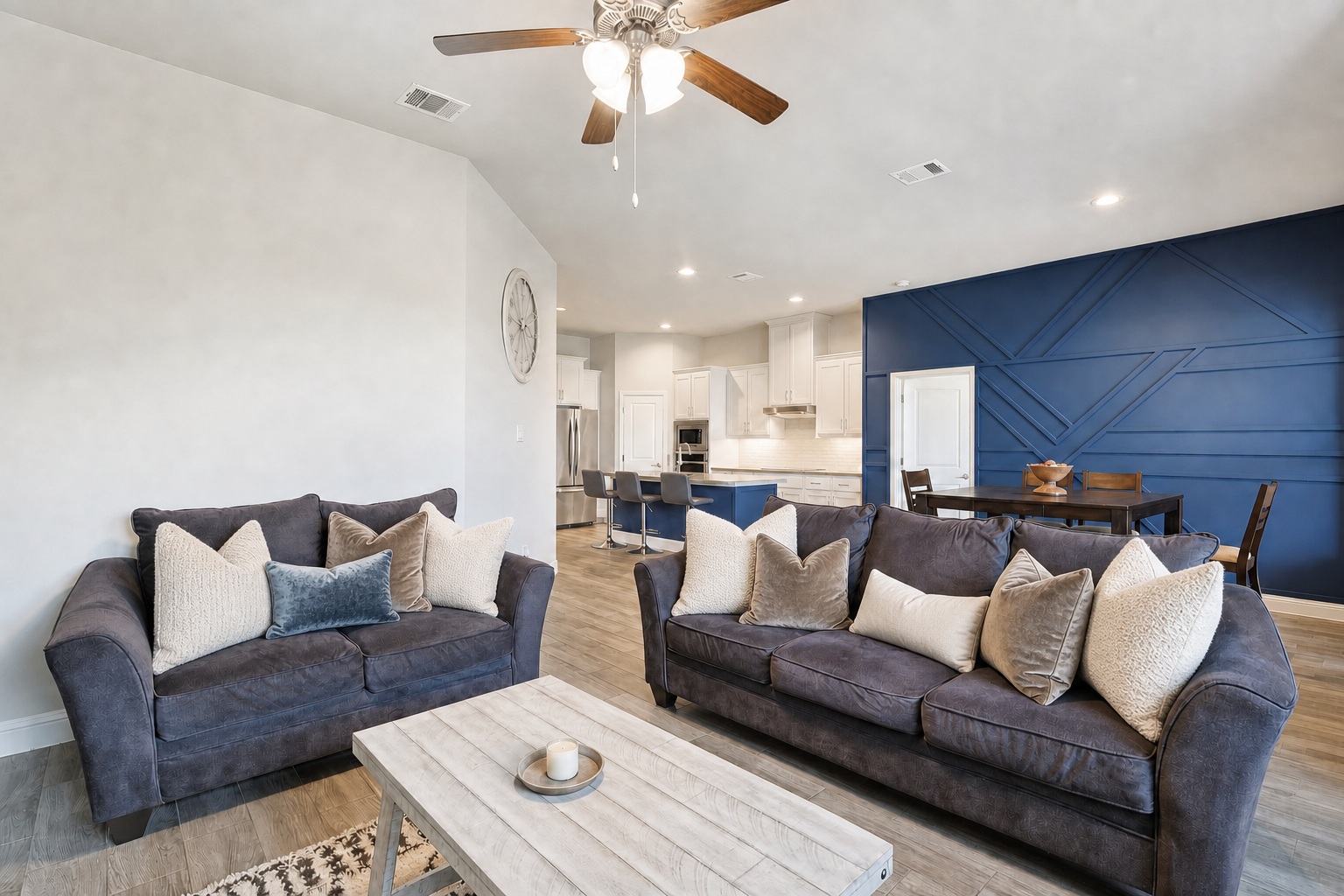 Living room with navy geometric accent wall